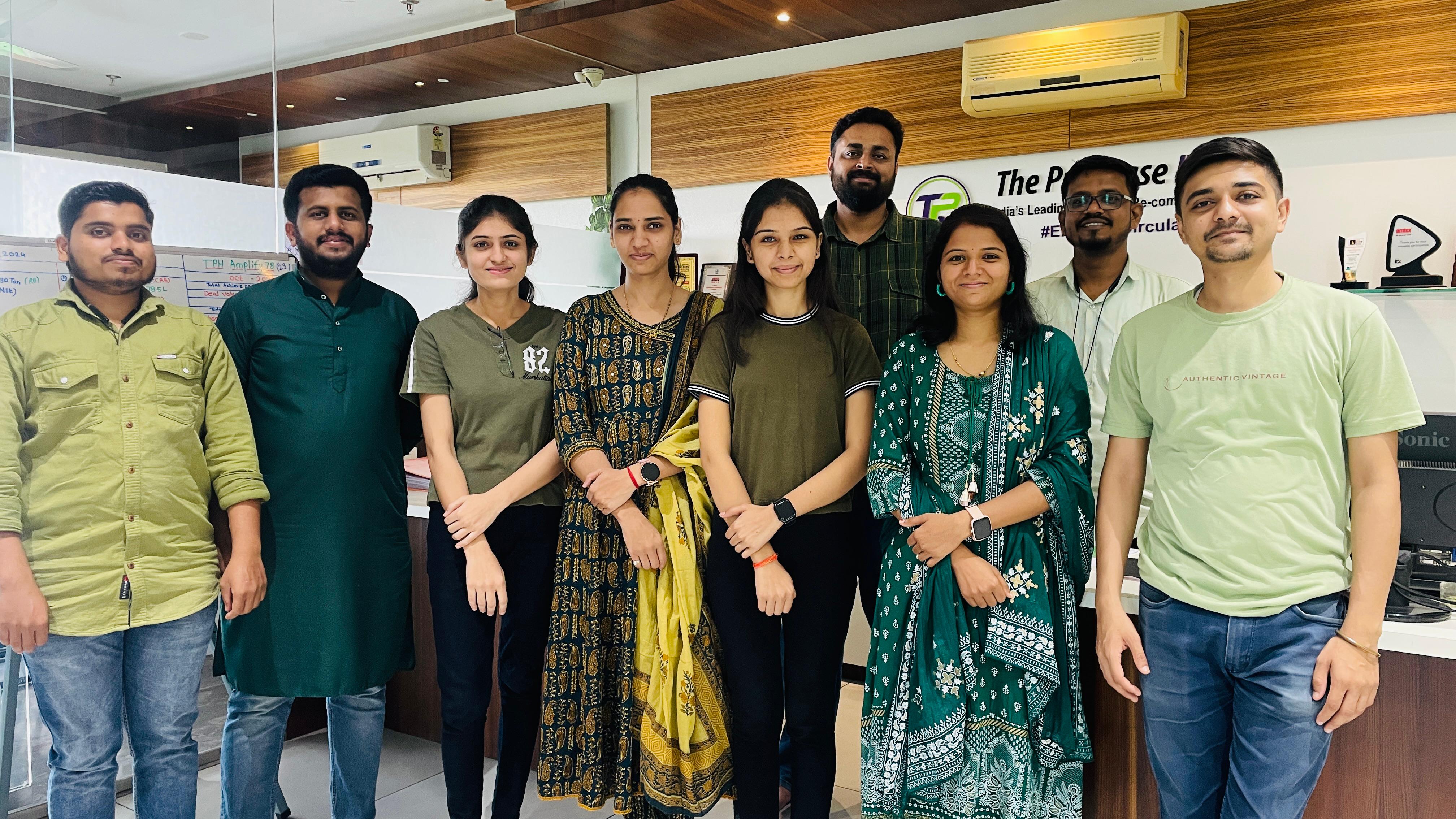 Team-members-posing-together-at-the-office